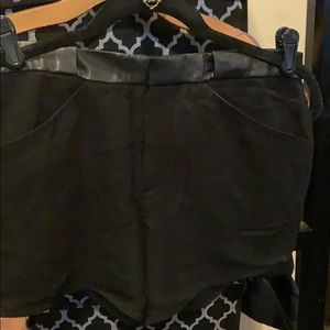 Black Helmut Lang shorts with leather accent.